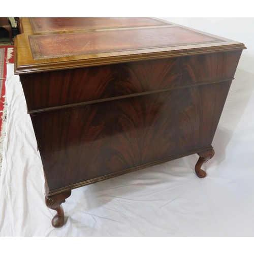 100 - Edwardian mahogany pedestal desk with seven drawers, leatherette inset, brass drop handles, on cabri... 