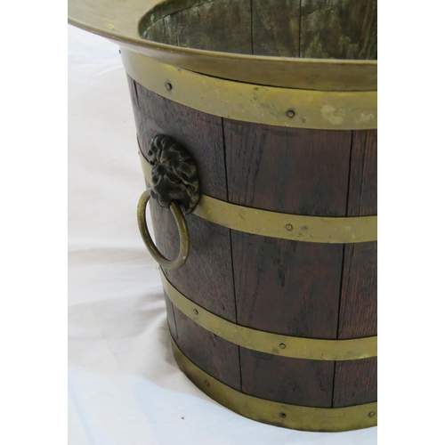 102 - Georgian style round bucket with brass rim and banding, lionmask brass drop handles