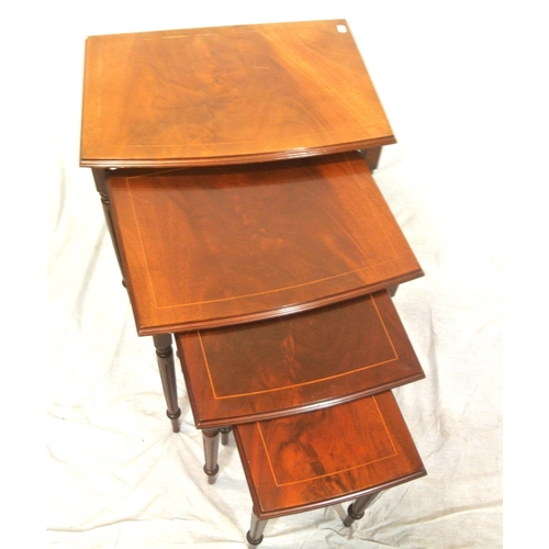 111 - Nest of four inlaid mahogany bow fronted tables with shaped borders & turned reeded tapering legs