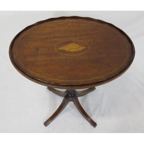 121 - Edwardian oval inlaid occasional table with wavy rim, shell inlay, raised on turned reeded tapering ... 