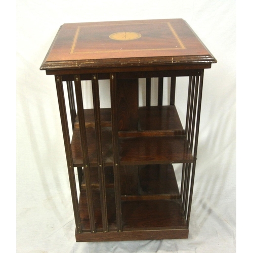 151 - Edwardian style inlaid & crossbanded mahogany revolving bookcase with shell motif & railed sides