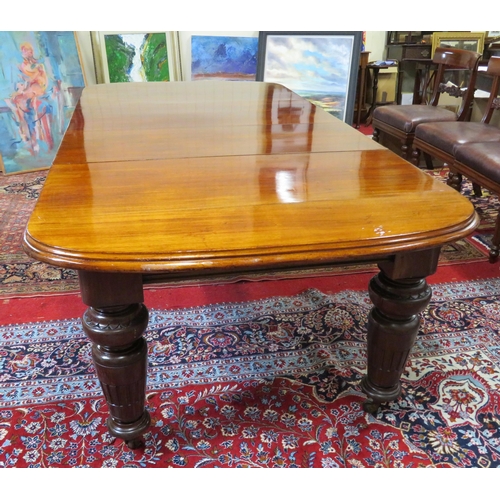 200 - Victorian mahogany extending dining table with two extra leaves inset, raised on baluster turned tap... 