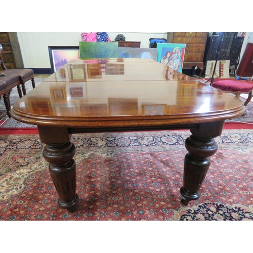 200 - Victorian mahogany extending dining table with two extra leaves inset, raised on baluster turned tap... 