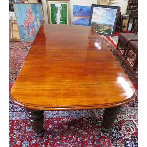 200 - Victorian mahogany extending dining table with two extra leaves inset, raised on baluster turned tap... 