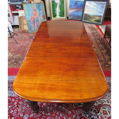 200 - Victorian mahogany extending dining table with two extra leaves inset, raised on baluster turned tap... 