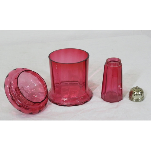 214 - Victorian cranberry glass biscuit or sweet jar with lid, having shaped finial & a matching sugar cas... 