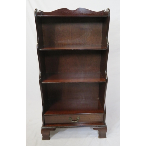 23 - Edwardian style four tier mahogany waterfall bookshelf with frieze drawer, on bracket feet