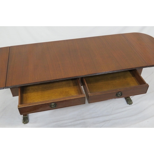 39 - Edwardian mahogany oblong coffee table with drop leaves, reeded borders, pull-out supports, on reede... 