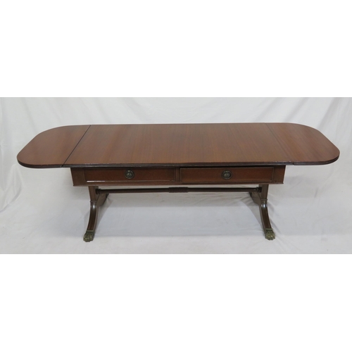 39 - Edwardian mahogany oblong coffee table with drop leaves, reeded borders, pull-out supports, on reede... 