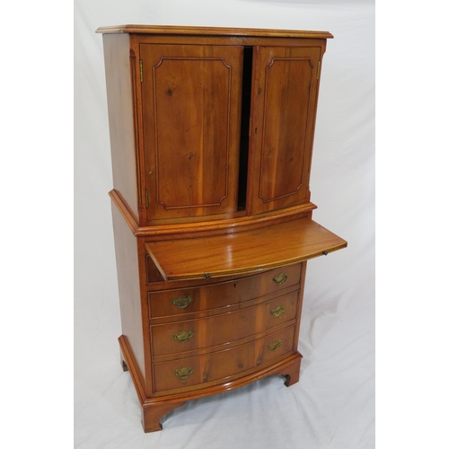 40 - Edwardian yew bachelors cabinet with pull-out shelf, four drawers under with brass drop handles, on ... 