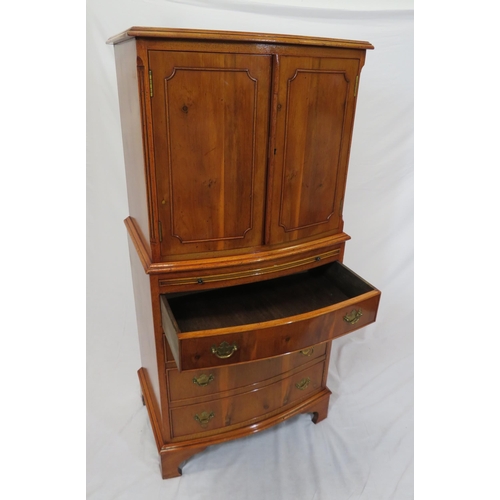 40 - Edwardian yew bachelors cabinet with pull-out shelf, four drawers under with brass drop handles, on ... 