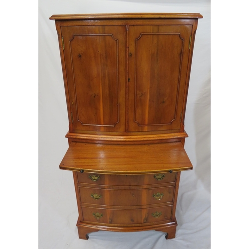 40 - Edwardian yew bachelors cabinet with pull-out shelf, four drawers under with brass drop handles, on ... 