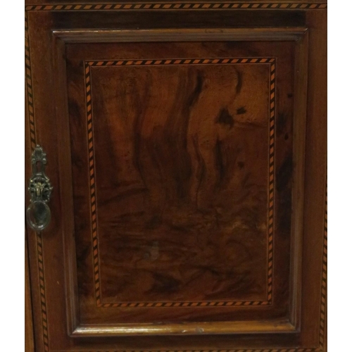 59 - Edwardian inlaid mahogany locker with shelved interior, panelled door & tapering legs