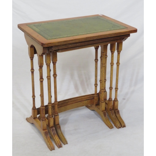 64 - Nest of three Edwardian yew tables with leatherette insets, reeded borders, turned columns & bracket... 