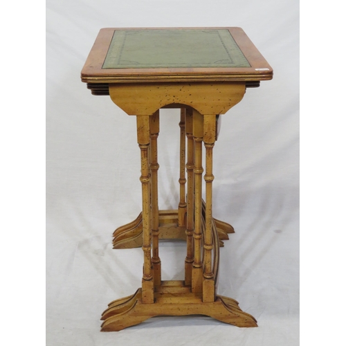 64 - Nest of three Edwardian yew tables with leatherette insets, reeded borders, turned columns & bracket... 