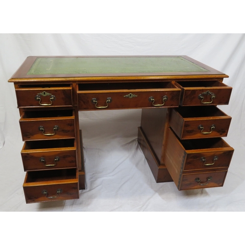 80 - Edwardian style yew pedestal desk with nine drawers, brass drop handles & escutcheons, on plinths