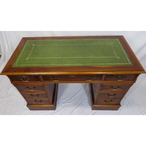 80 - Edwardian style yew pedestal desk with nine drawers, brass drop handles & escutcheons, on plinths