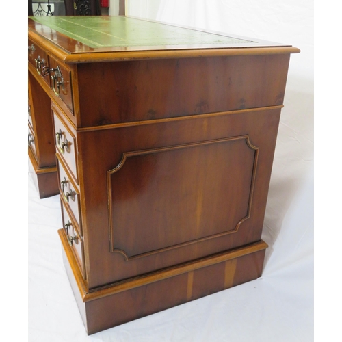 80 - Edwardian style yew pedestal desk with nine drawers, brass drop handles & escutcheons, on plinths