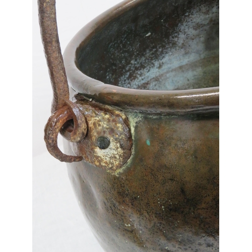 88 - Large Georgian style copper cauldron with shaped handle