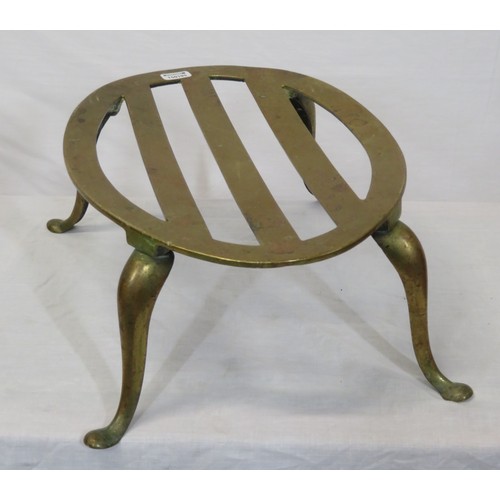 237 - Oval brass fireside trivet with railed top and shaped legs