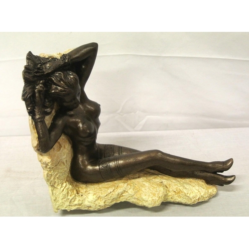 258 - Ornate bronzed ornament of a reclining nude, on shaped base