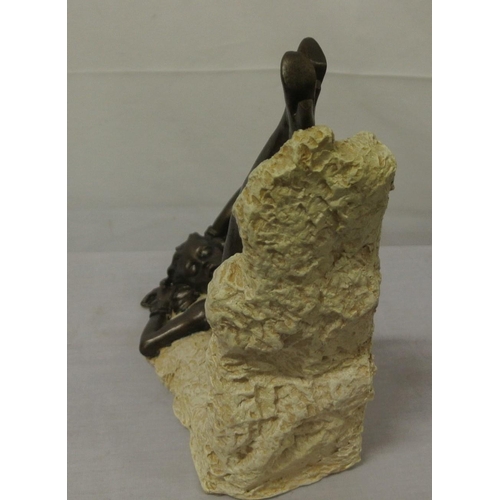 258 - Ornate bronzed ornament of a reclining nude, on shaped base