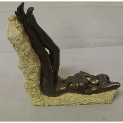 258 - Ornate bronzed ornament of a reclining nude, on shaped base