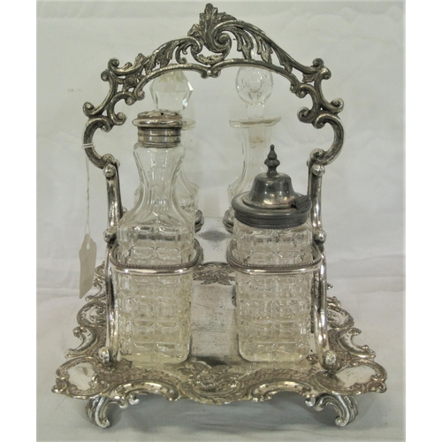 10 - Victorian style silverplated cruet set with glass bottles and ornate scroll and foliate decoration