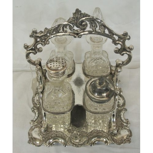 10 - Victorian style silverplated cruet set with glass bottles and ornate scroll and foliate decoration