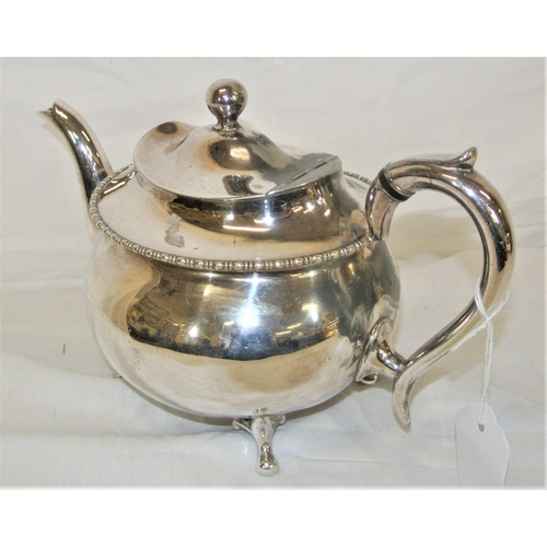 22 - Silver plated round teapot with beaded rim and shaped handle, on 4 feet