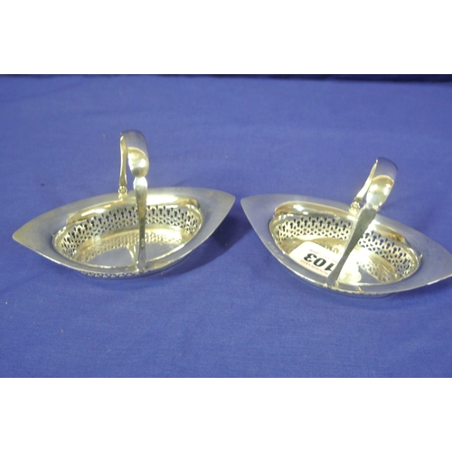 103 - Pair of Birmingham silver oval sweet baskets with pierced decoration and swing handles.100g.