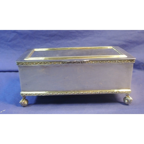 264 - Irish silver jewellery or cigarette box with gadroon decoration, on 4 cast scroll feet and with timb... 