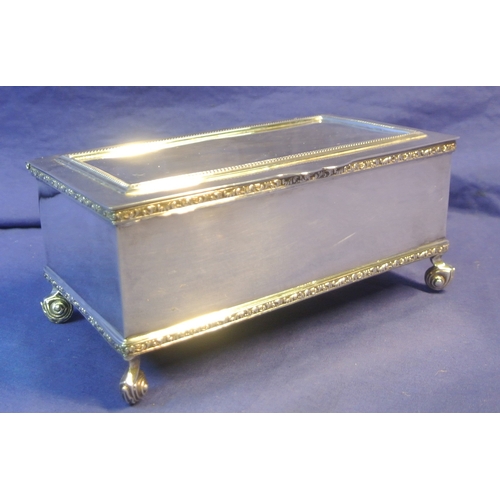 264 - Irish silver jewellery or cigarette box with gadroon decoration, on 4 cast scroll feet and with timb... 