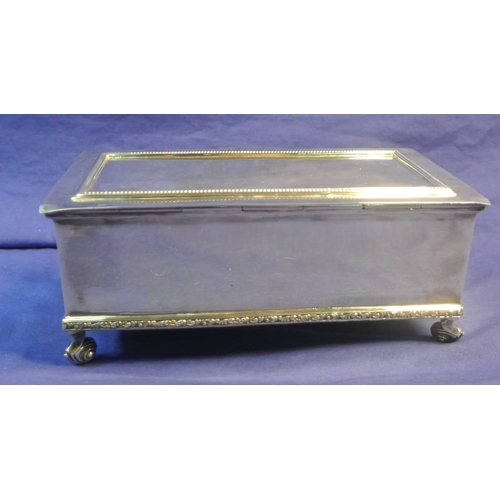 264 - Irish silver jewellery or cigarette box with gadroon decoration, on 4 cast scroll feet and with timb... 