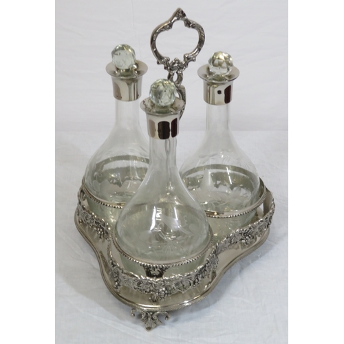 34 - Victorian silverplated tantalus with 3 glass bottles inset, on shaped base