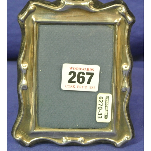 267 - Irish silver photograph frame with shaped scroll borders, Dublin 1995. H13 X10cm