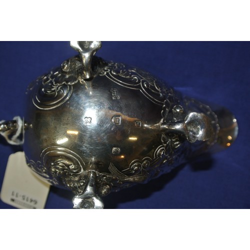 281 - Irish silver boat shaped sauceboat decorated with birds, scrolls, swags and cartouche, S-scroll hand... 