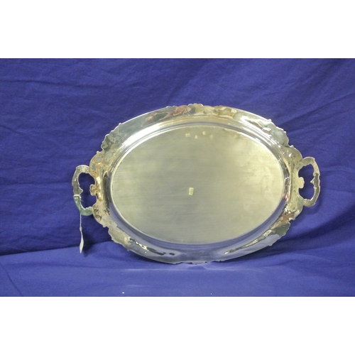 299 - Royal Irish silver oval serving tray with foliate and scroll borders, shaped handles, Dublin 1971. 1... 