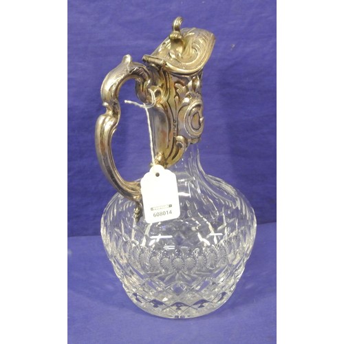 94 - Victorian style glass claret jug with silverplated handle and top. H 25cm