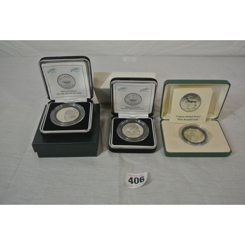 406 - Three coins. Central Bank of Ireland 1990 Cupro-Nickle Proof £1.00 Coin. Two 2000 Millennium Silver ... 