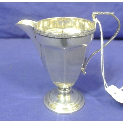 47 - Birmingham silver creamewer of tapering panelled form, with decorated rim and shaped handle 104g 9cm