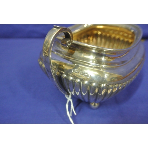 66 - Sheffield silver sugar bowl and creamer with reeded decoration and shaped handles. 310g