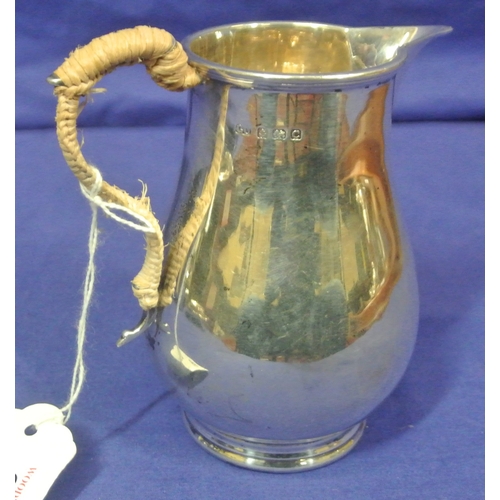 68 - Birmingham silver creamewer of baluster form, with shaped handle and round base, 244g 12cm