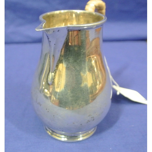 68 - Birmingham silver creamewer of baluster form, with shaped handle and round base, 244g 12cm