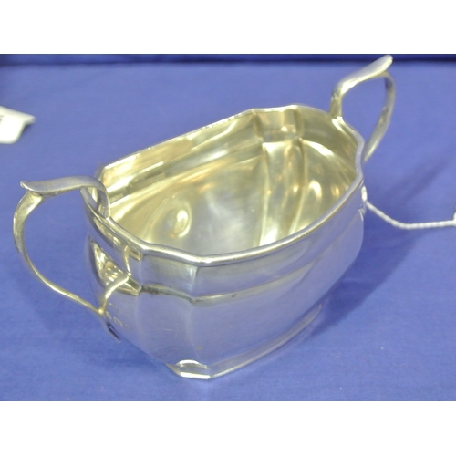 69 - Birmingham silver sugar bowl with panelled corners and shaped handles, dated 1934 /225g