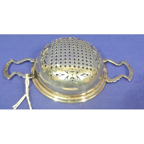 78 - Birmingham silver tea strainer with shaped handles.  48g