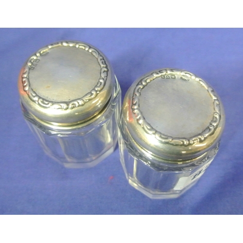 82 - Pair of Chester silver topped dressing table jars. H 6.5cm