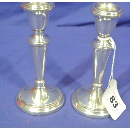 83 - Pair of Birmingham silver candlesticks with round reeded bases 1977 12.5cm, 169g