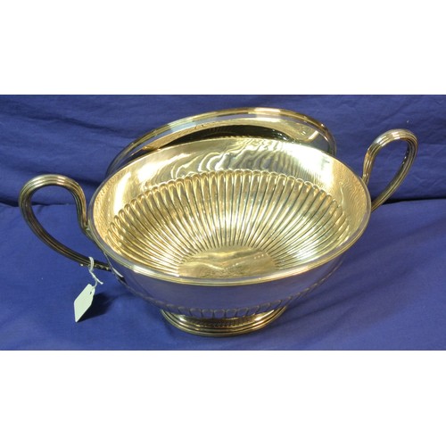 13 - Silverplated oval tureen with ribbed socles and shaped handles