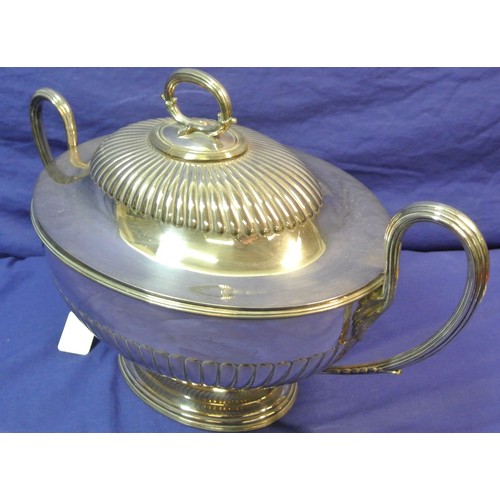 13 - Silverplated oval tureen with ribbed socles and shaped handles